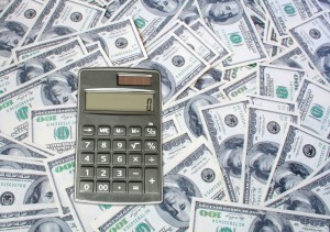 calculator on 100 dollar bills